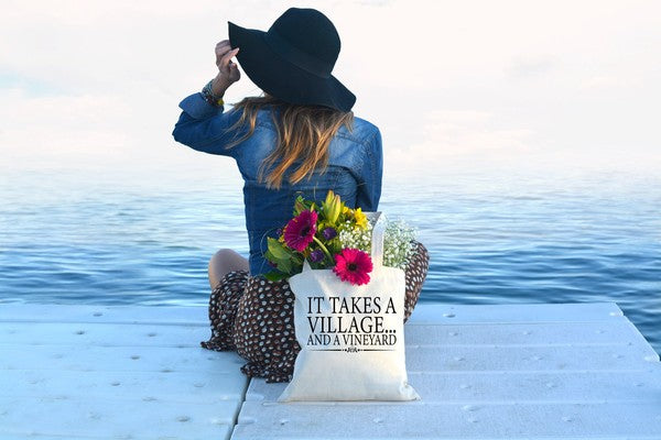 It takes a village tote bag